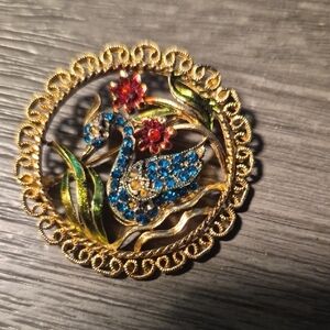 Vintage-Inspired Gold-tone Swan Brooch with Blue and Red Rhinestones